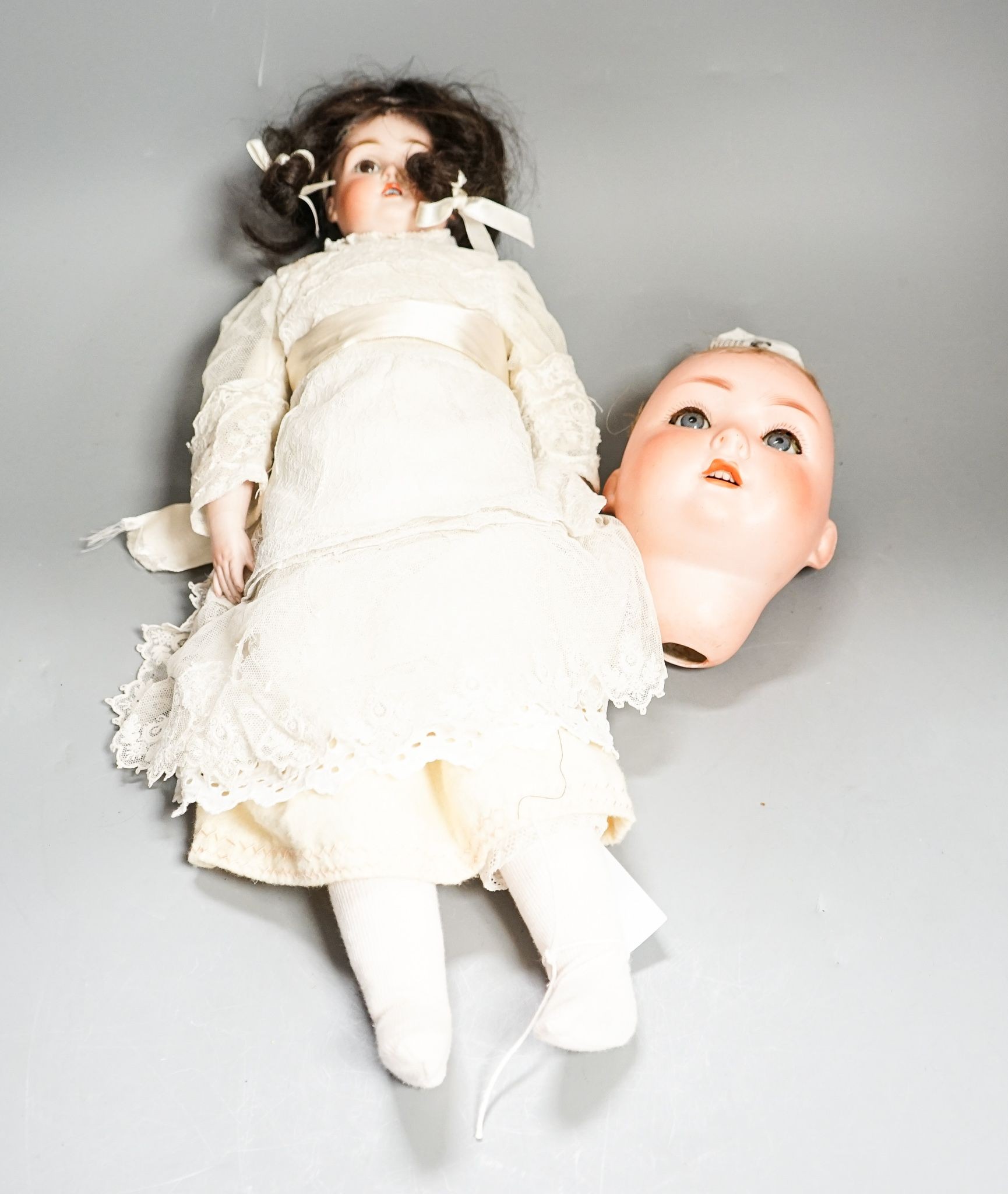 J D Kestner, bisque doll and a Schwenau & Hoffmeister bisque head